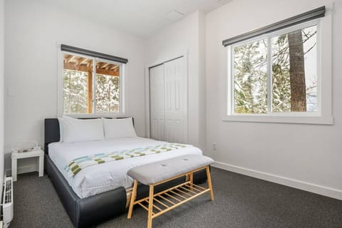 Primary bedroom with a queen bed & room-darkening shades.