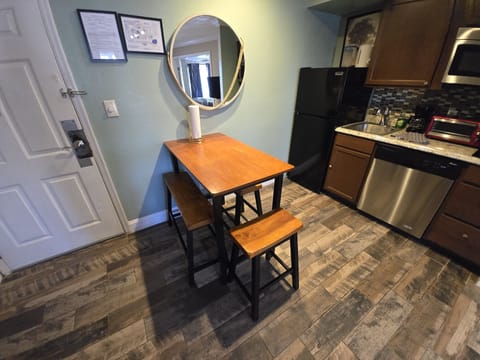 Bright and welcoming table for four—perfect for meals or game nights.