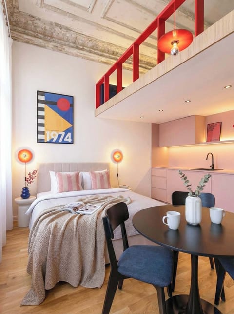 Photo of the lower floor of the apartment with queen size bed and kitchen