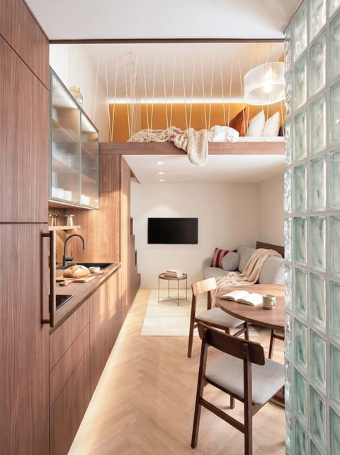 Loft apartment with living room in the lower floor and two queen size beds in the upper bedroom