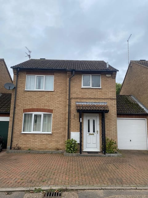 Front of house with parking for multiple cars