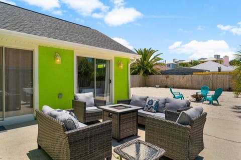 Unwind in private backyard with hot tub, fire table, fire pit and cozy seating.
