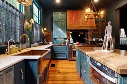 Warm brass fixtures, rich cabinetry, and lots of counter space give this kitchen both style and function.