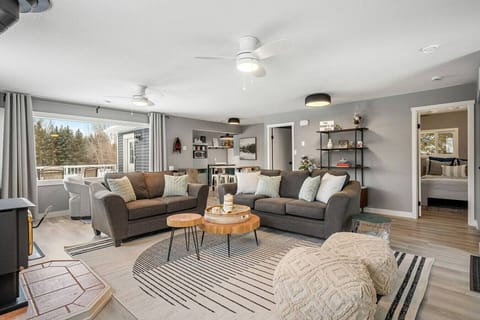 Living room with a wood-burning fireplace, board games, a Smart TV, cozy seating & more. There`s also a single rollaway cot (with bedding) for additional sleeping space.