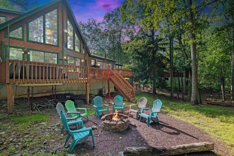 Outdoor Retreat: Gather around the firepit with colorful chairs for unforgettable moments under the stars!