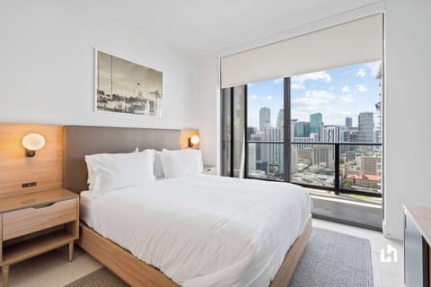 The bedroom has balcony access and room-darkening shades