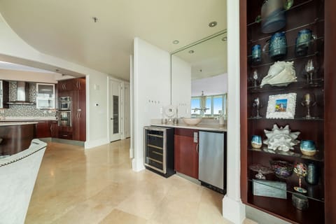 Elevate your entertaining experience with the convenience of this stylish wet bar. Perfect for crafting cocktails and keeping refreshments close at hand.