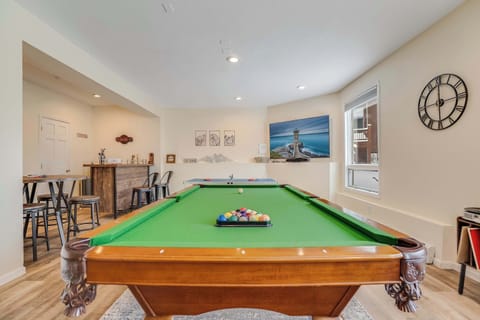 Game room with Billiards, Ping-Pong, Gaming Console, Arcade Games, Record Player, Poker table with Poker set, Bar with glassware and bar tools, and Flatscreen TV with Sonos Sound Bar.