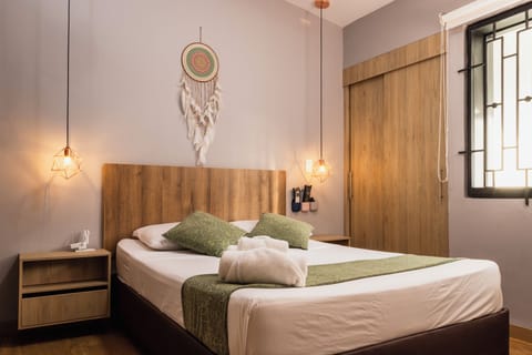 Superior Quadruple Room, City View | In-room safe, desk, laptop workspace, bed sheets