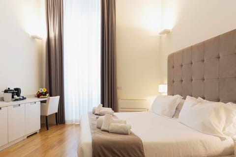 Deluxe Double Room, Balcony, City View | Minibar, in-room safe, desk, laptop workspace