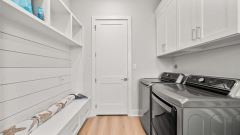 Laundry room with ample space for tackling laundry and storing your essentials