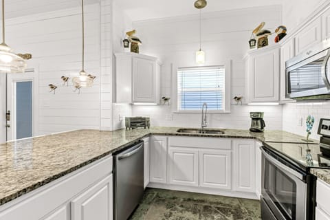 Kitchen - This bright, fully equipped kitchen is perfect for cooking and creating delicious memories during your beach getaway