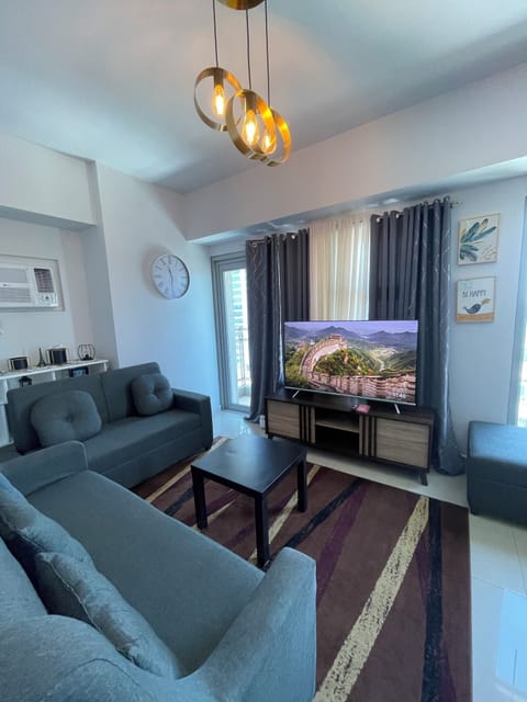Luxury Condo, 1 Queen Bed, Balcony, Ocean View | Living area | Flat-screen TV