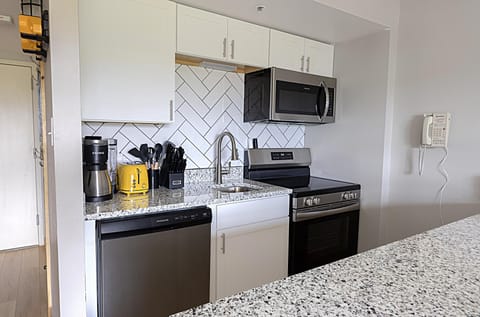The modern, fully equipped kitchen is perfect for preparing anything from a quick snack to a gourmet meal.