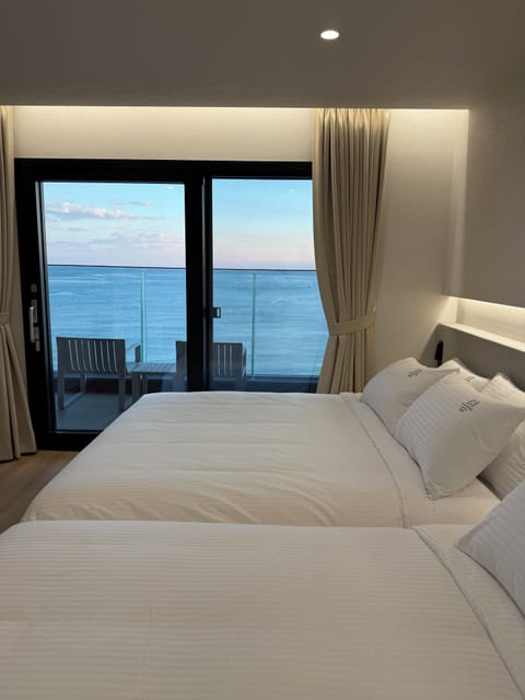 Signature Room, Balcony, Sea View | Blackout drapes, free WiFi