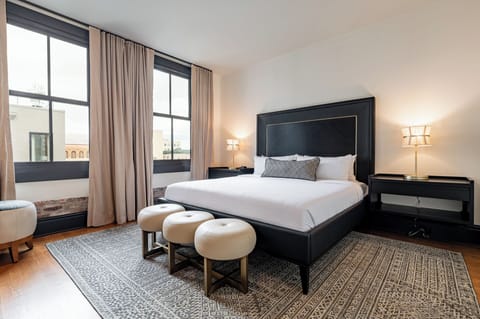 Bedroom 1 - King bed featuring a built-in wardrobe and flat-screen TV.