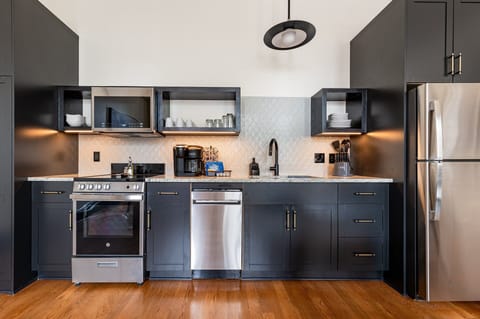 Fully equipped kitchen with modern appliances, offering everything you need for preparing meals or enjoying a morning coffee.