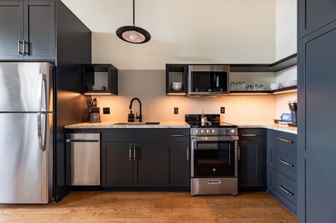 Fully equipped kitchen with modern appliances, offering everything you need for preparing meals or enjoying a morning coffee.