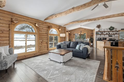 Warm coffee, snowy lake views and rustic charm—your cozy winter cabin escape.