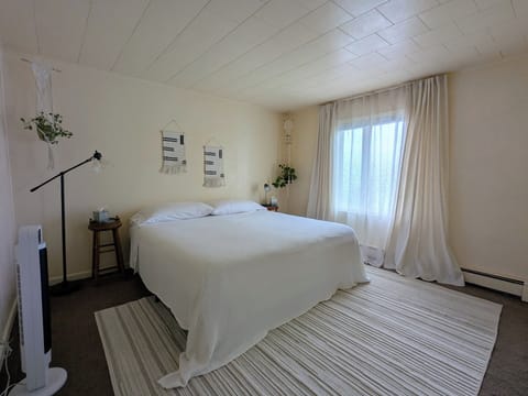 Bedroom 1: King-size bed, bright & airy.  Includes room-darkening curtains.