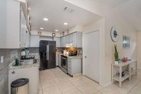Garage entrance with access to washer and dryer