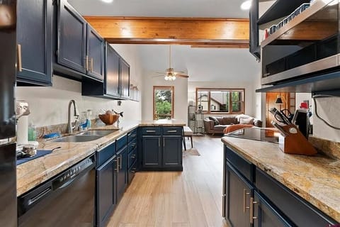 Kitchen - Galley kitchen which leads to back porch and grill