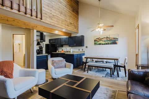 Living room - The living room features inviting space which flows seamlessly into the dining area and fully equipped kitchen.