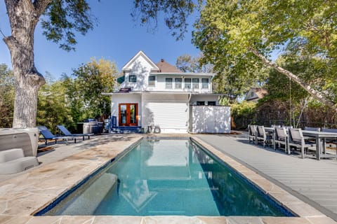 Experience the perfect outdoor retreat in this fenced backyard, featuring a refreshing pool and a clear view of the house, combining relaxation and privacy.