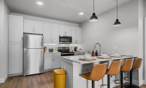 The fully equipped kitchen features sleek, modern appliances and ample counter space, making it easy to prepare your favorite meals. Whether you’re brewing a morning coffee or eating in. You will have everything you need to make your favorite meals.