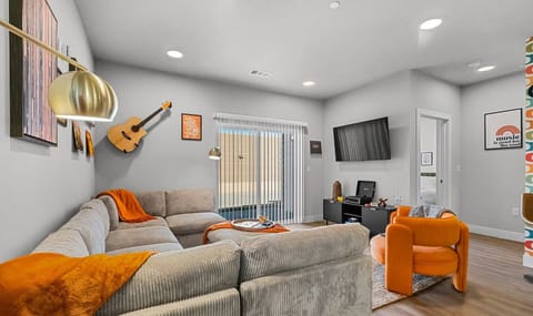 The Open Living Area is Filled with Natural Light and Boasts Chic Furnishings, Creating an Inviting Atmosphere for Both Relaxation and Entertainment.