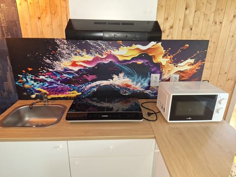 Deluxe Quadruple Room, Garden View | Private kitchen | Shared fridge, microwave