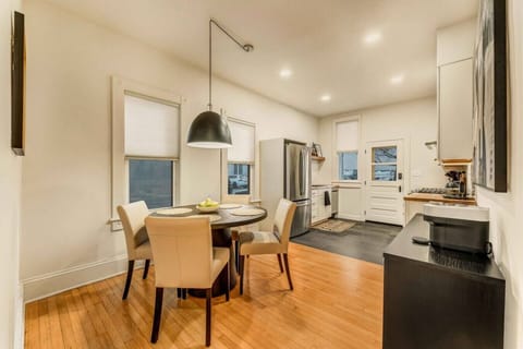 Cozy dining area in Unit 2, located in the kitchen, perfect for enjoying meals with seating for 4 guests.