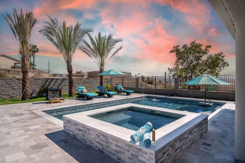 Resort Style Backyard - Private yard with:Lake Views, Pool, Spa, Huge Patio, Outdoor Kitchen, Putting Green, Misters, Water Features, Fire Pit, and Garage Roll Up Door for access to game room, industrial ice maker, and SnoCone machine!