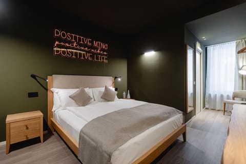 Standard Double Room | Minibar, in-room safe, desk, blackout drapes