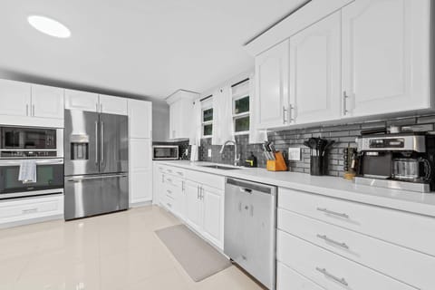 Whip up culinary delights in this sleek, modern space with ample amenities!