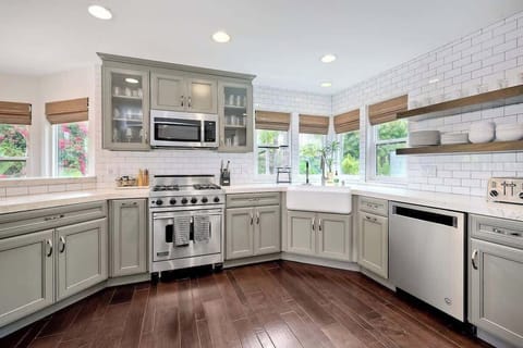 Fully stocked open chefs kitchen with tons of natural light 