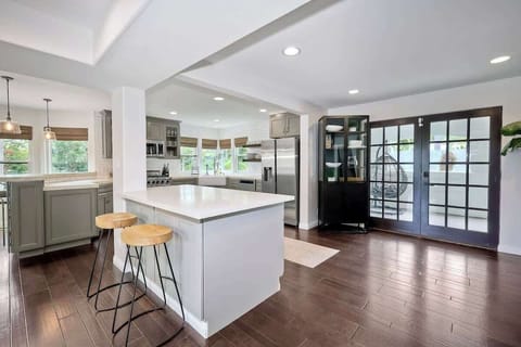 Fully stocked open chefs kitchen with tons of natural light 
