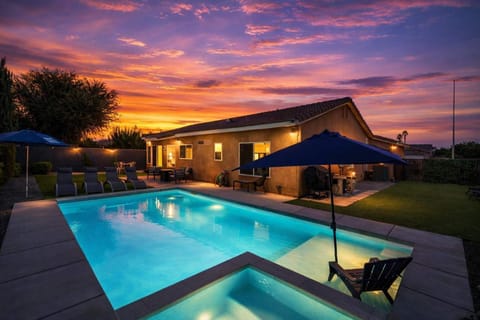 Outdoor Pool Area. Some exterior lighting shown in this image may not be present or turned on during your stay.