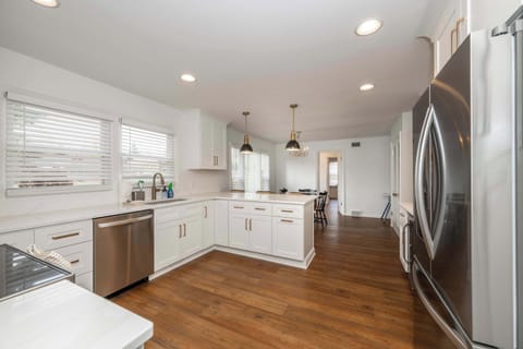 The sophisticated kitchen offers ample space & every home comfort