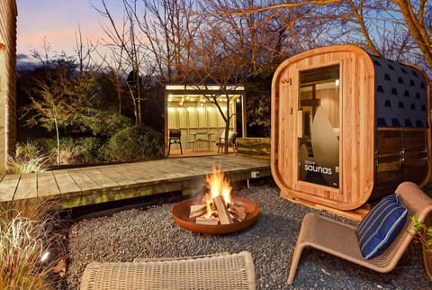 Light the fire in the fire pit while you wait for the sauna to heat up and then alternate between the sauna and the cold plunge bath.