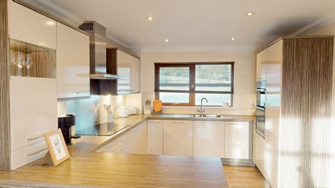 A fully equipped modern kitchen with all the appliances needed for a family holiday.