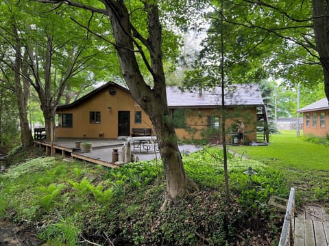 A peaceful stream gently flows at the back of the property, adding to the tranquility of the setting.