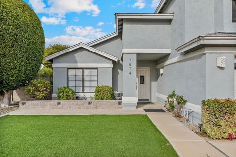 Lush landscaping welcomes you to the front door.