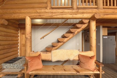Here's the entryway and the stairs up to the loft. We love all the rustic woodwork in the cabin!