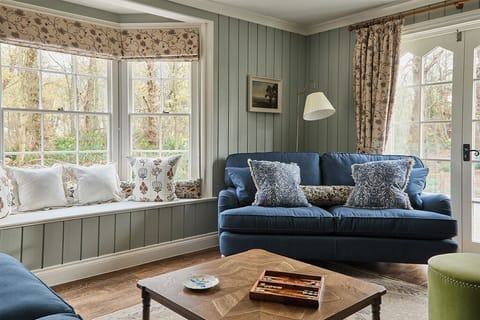 Dual aspect, French doors to outdoor terrace, wood burner, large smart TV