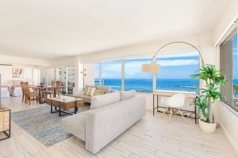 Lving room that boasts an unobstructed view of the ocean.