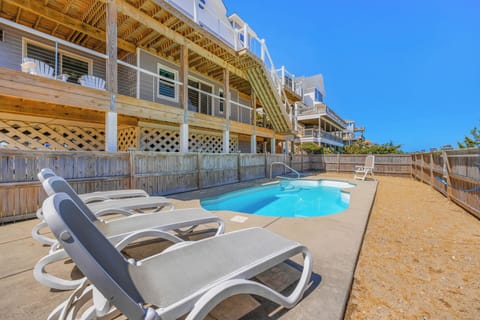 Soak up the coastal sunshine on your private pool deck with loungers perfectly positioned for all-day relaxation under clear blue skies.