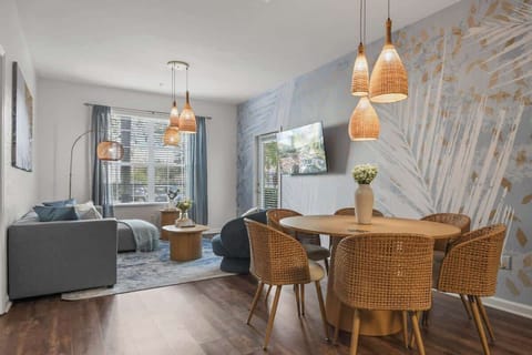 Unwind in this airy, stylish retreat! Cozy living space, chic dining area, and serene vibes create the perfect escape after thrilling theme park adventures. Minutes from Disney and Universal—book your magical getaway today!