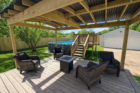 Relaxing backyard with heated pool, cozy fire pit, and gazebo
