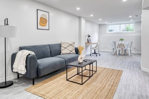 You feel a sense of peace as you step into the living room , with its inviting decor and soothing tones.